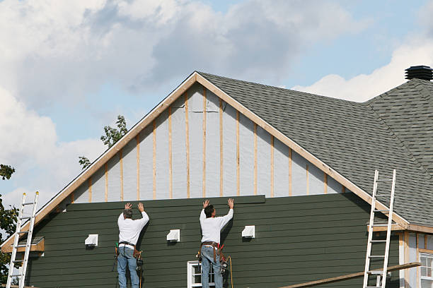 Professional Storm Damage Siding Repair technician working in Central, TN